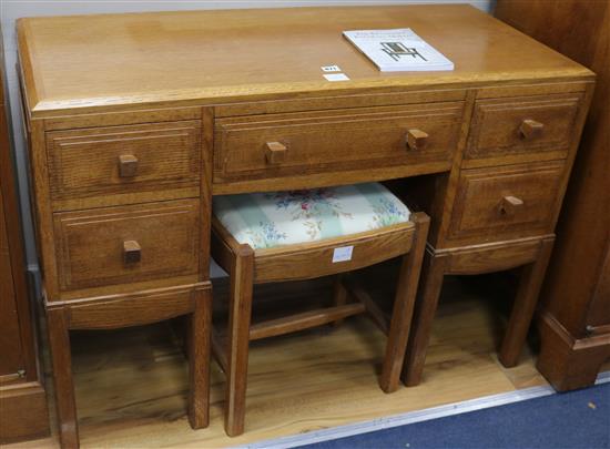 A Brynmawr oak dressing chest, fitted five small drawers and matching dressing stool W.41cm